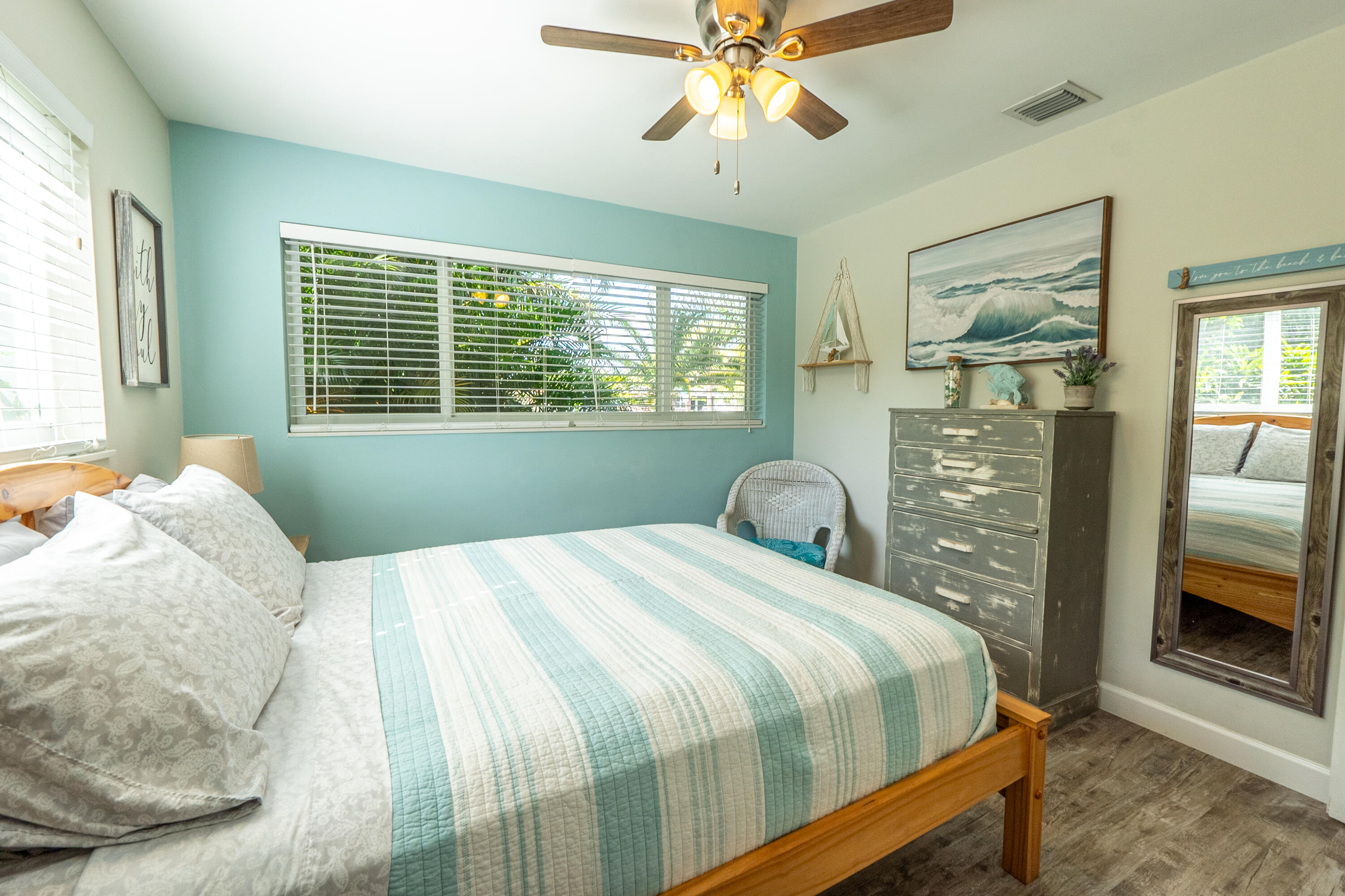 400 Pittsburgh Drive Jupiter, FL 33458 - Photo 14 of 30 a bedroom with a bed and a flat tv screen on dresser