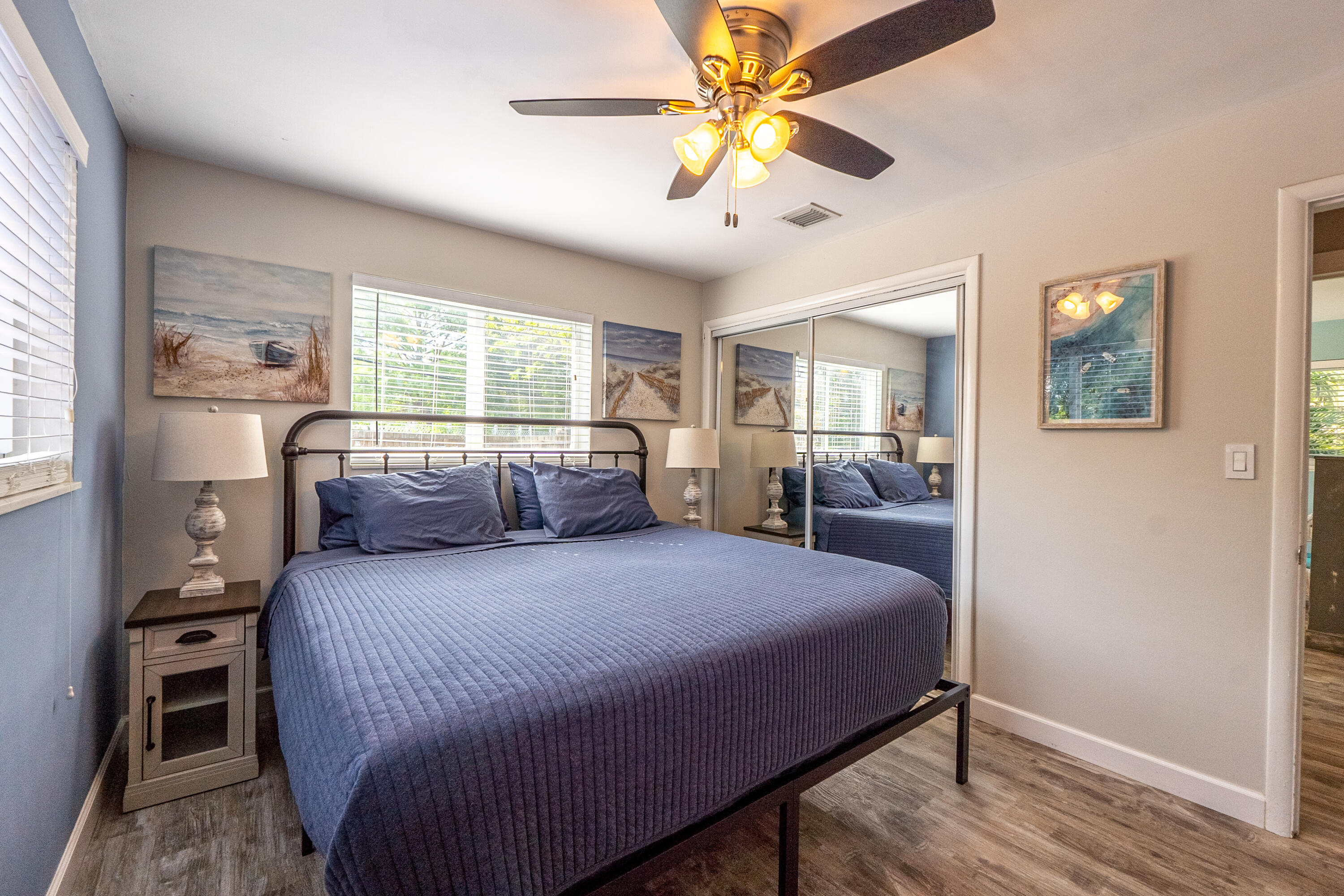 400 Pittsburgh Drive Jupiter, FL 33458 - Photo 16 of 30 a bedroom with a large bed and a chandelier