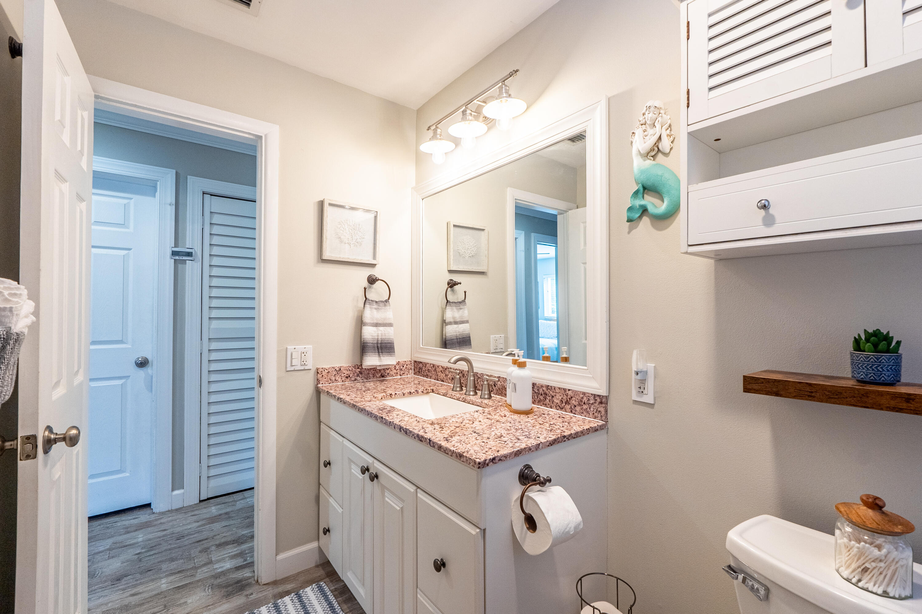 400 Pittsburgh Drive Jupiter, FL 33458 - Photo 18 of 30 a bathroom with a granite countertop sink and a mirror
