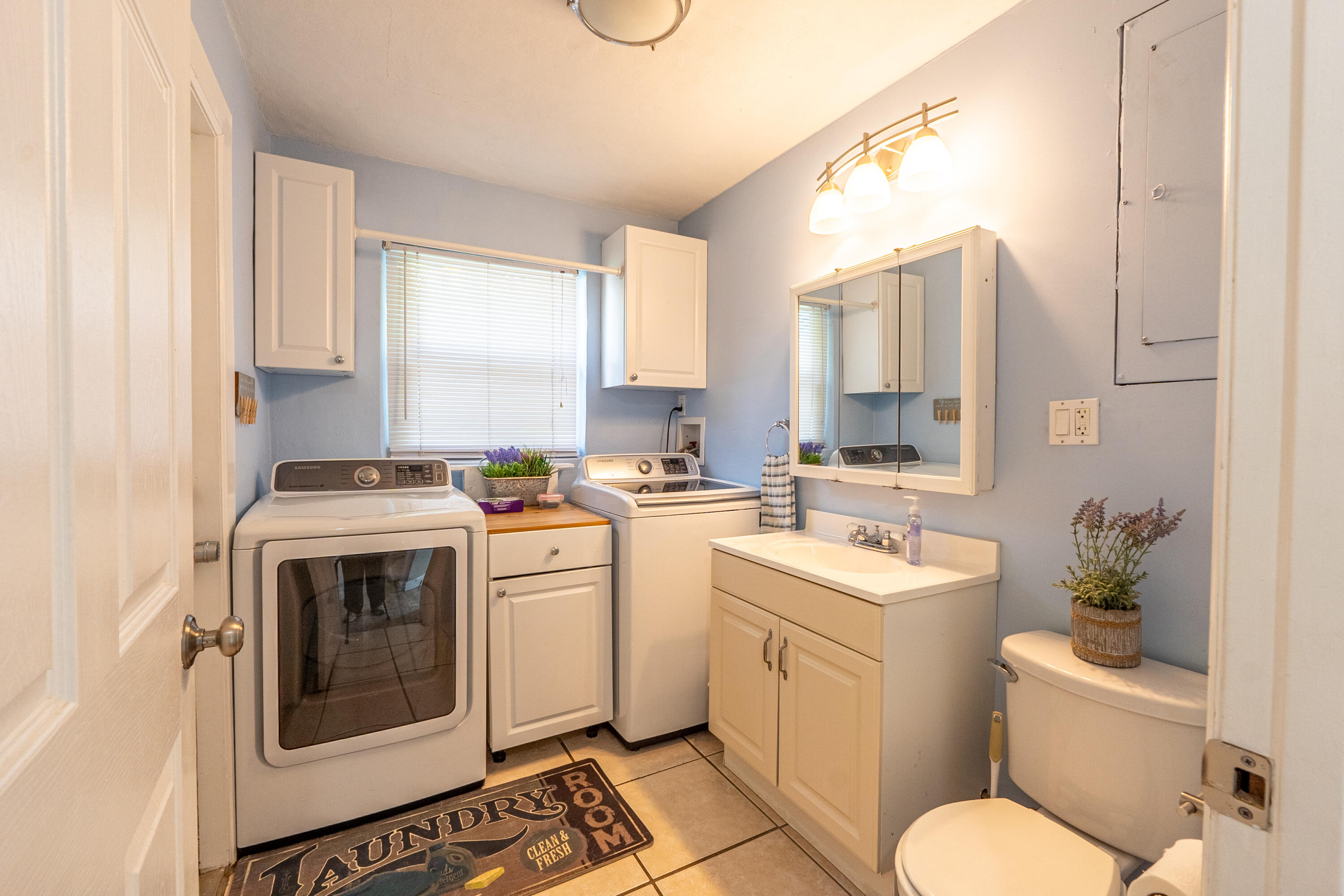 400 Pittsburgh Drive Jupiter, FL 33458 - Photo 19 of 30 a view of bathroom with a toilet sink and mirror