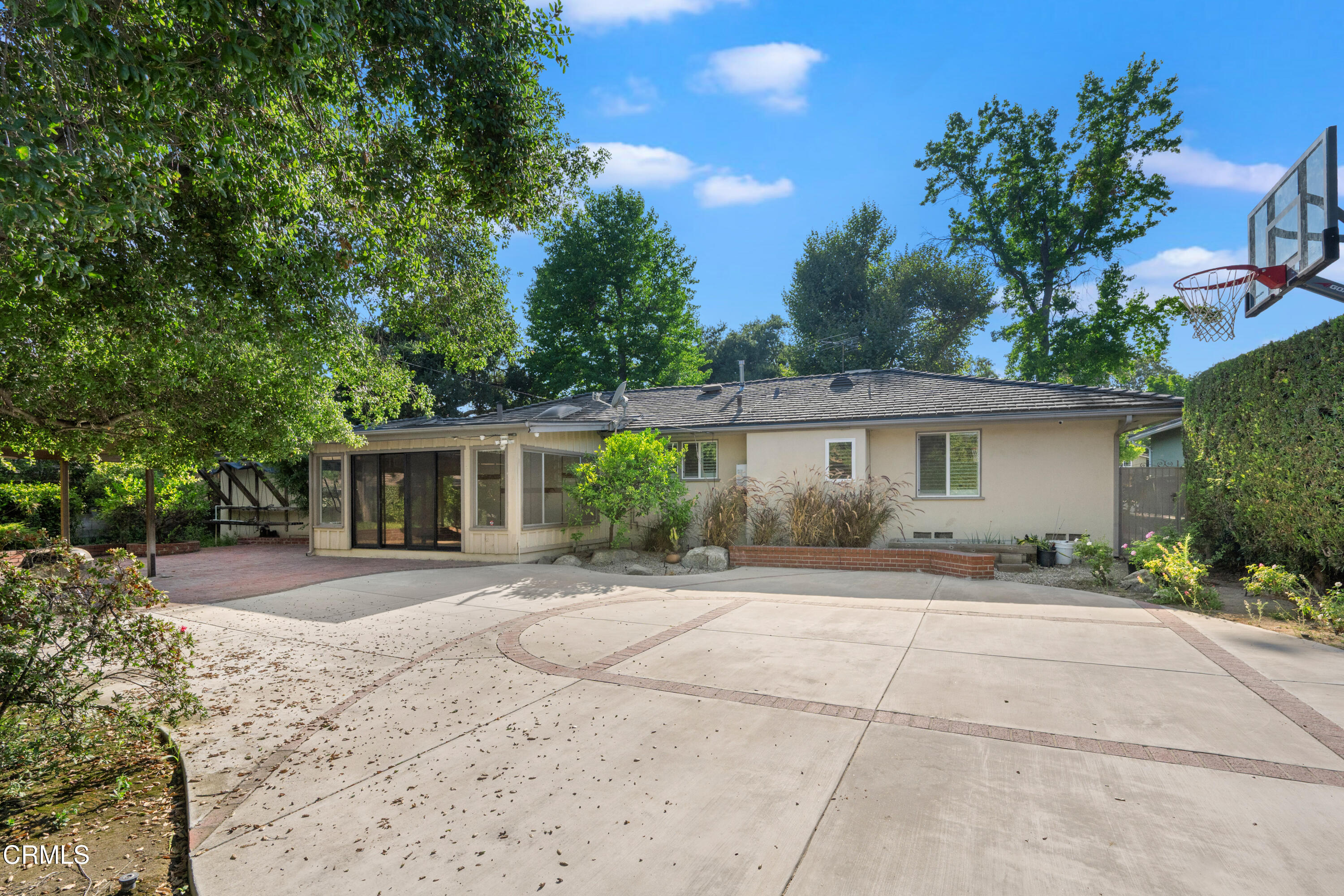 1626 Rodeo Road Arcadia, CA 91006 - Photo 15 of 25 a front view of a house with a yard and potted plants