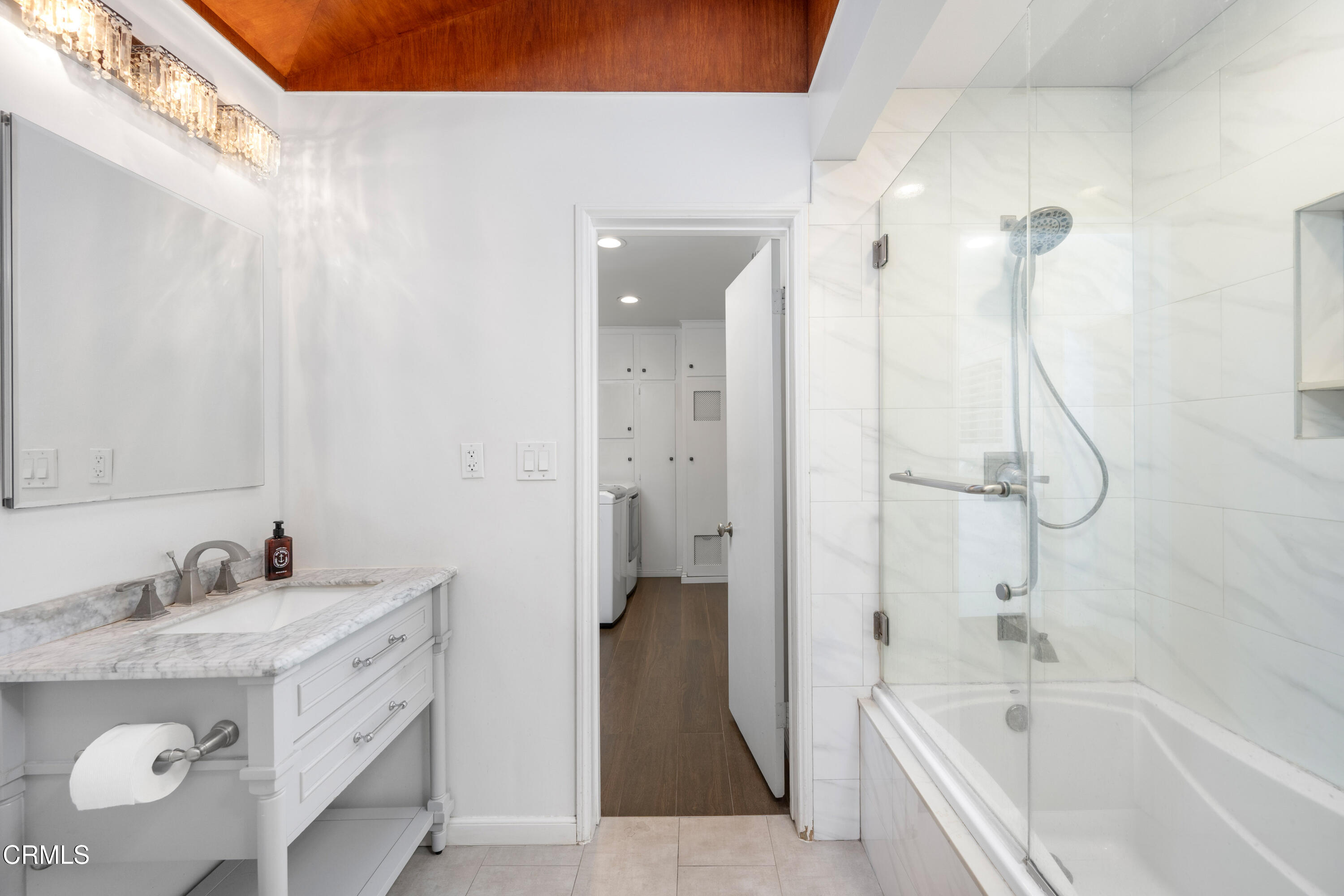 1626 Rodeo Road Arcadia, CA 91006 - Photo 20 of 25 a bathroom with a granite countertop sink a mirror and a bathtub