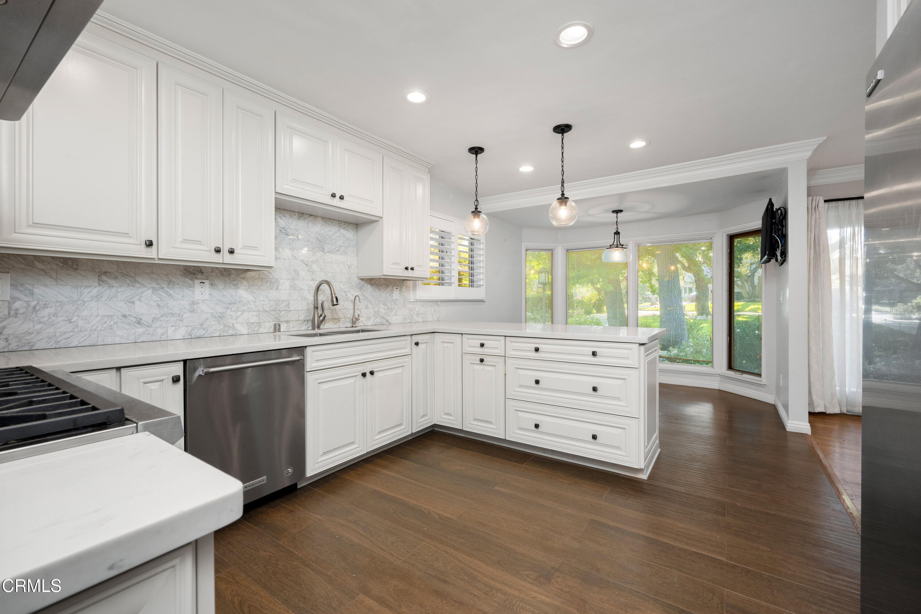 1626 Rodeo Road Arcadia, CA 91006 - Photo 4 of 25 a kitchen that has a lot of cabinets in it and wooden floors