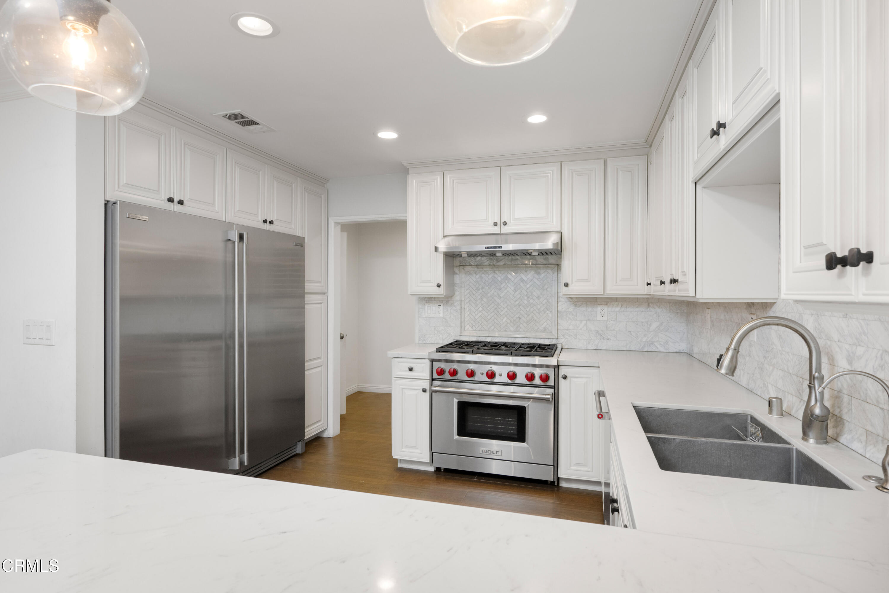 1626 Rodeo Road Arcadia, CA 91006 - Photo 5 of 25 a kitchen with a stove a sink and a refrigerator