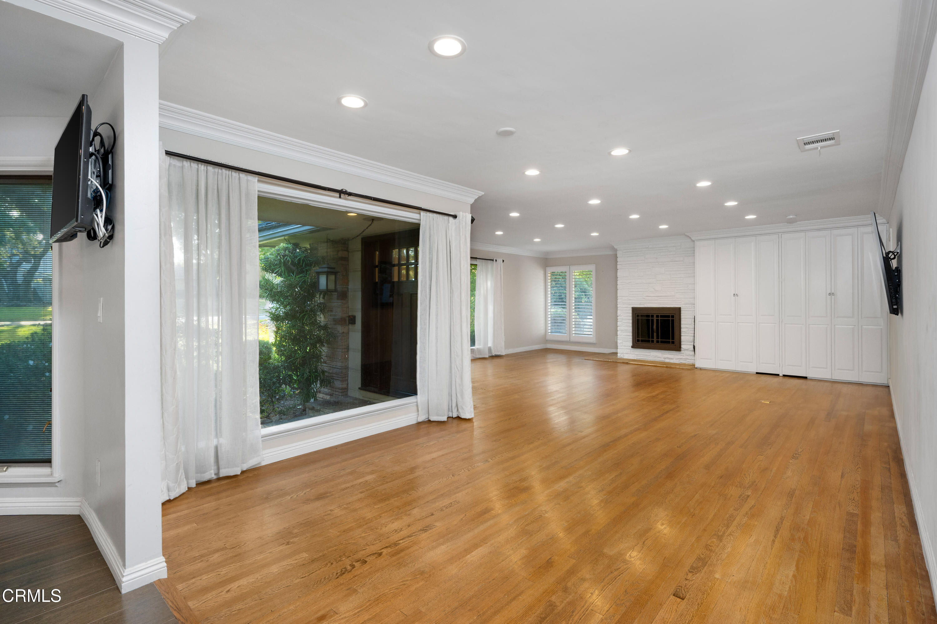 1626 Rodeo Road Arcadia, CA 91006 - Photo 9 of 25 a view of an empty room with a window and a kitchen