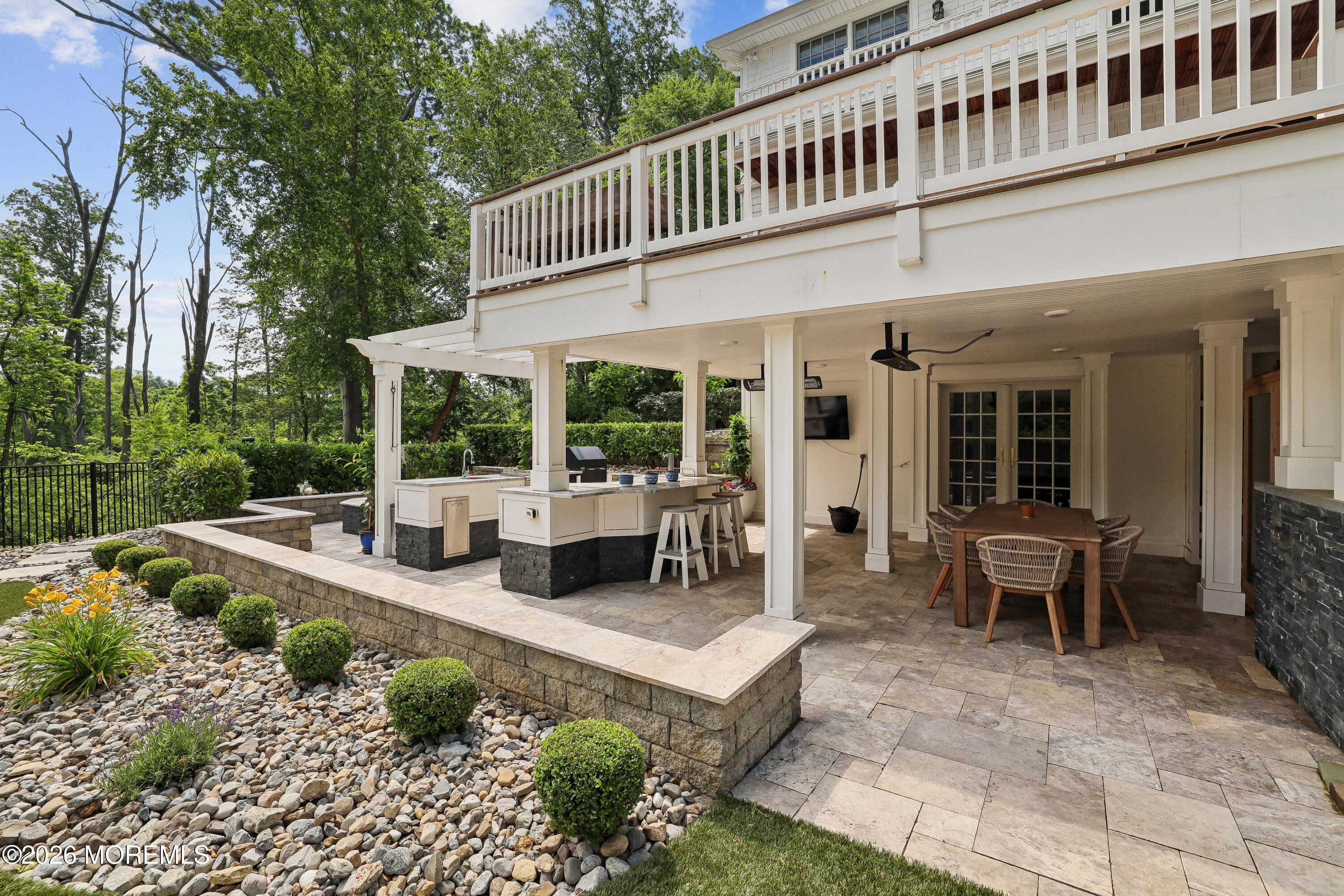 92 Tulip Lane Colts Neck, NJ 07722 - Photo 41 of 55 a view of a house with backyard porch and sitting area