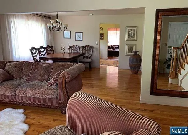 a living room with furniture or couch and a flat screen tv