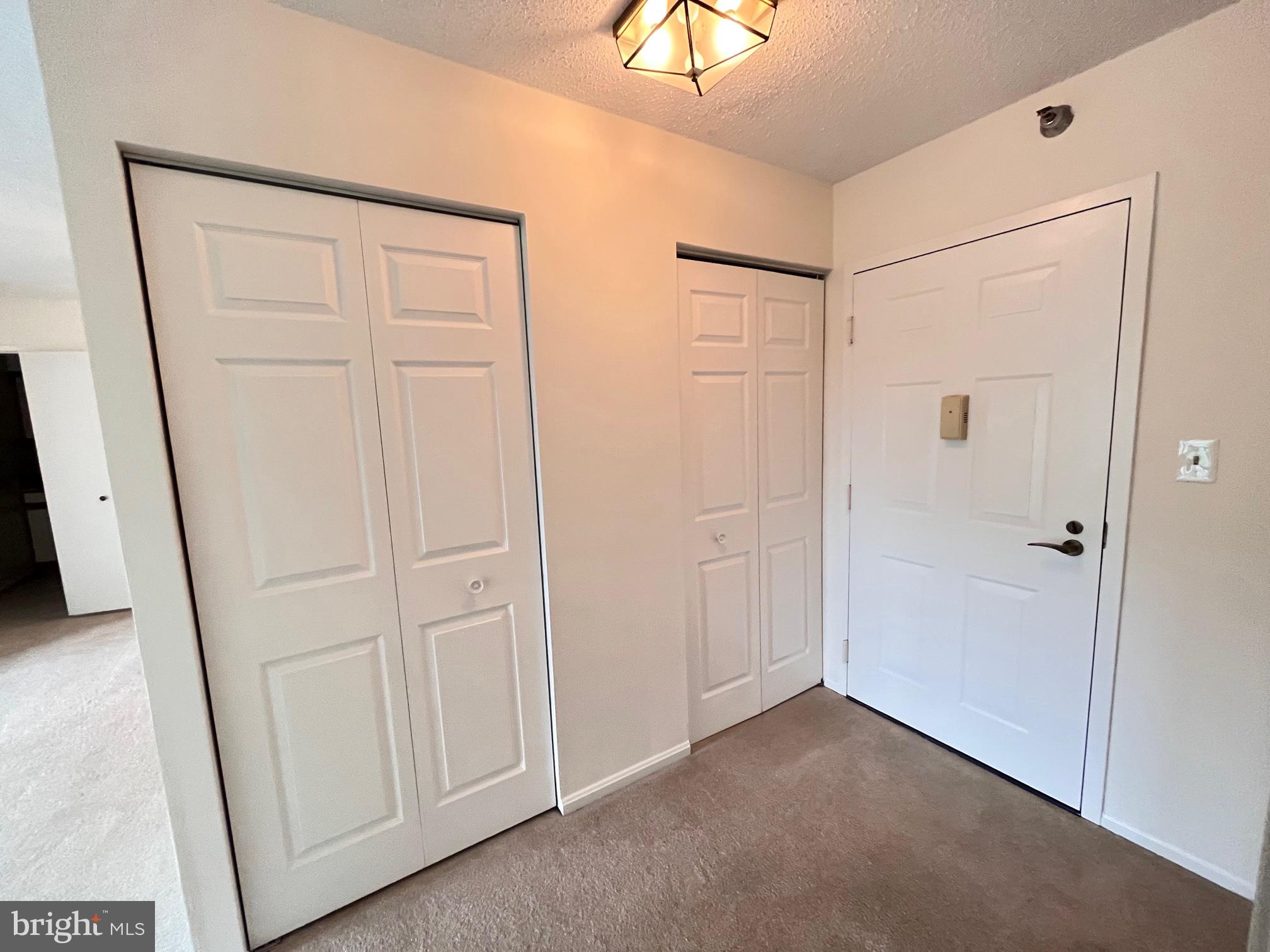15100 Interlachen Drive, Unit 815 Silver Spring, MD 20906 - Photo 2 of 26 Entry, coat closets