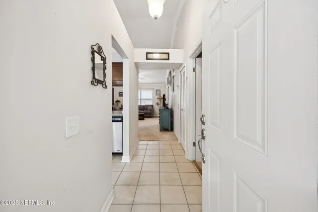 a kitchen with stainless steel appliances granite countertop a refrigerator a stove and a sink