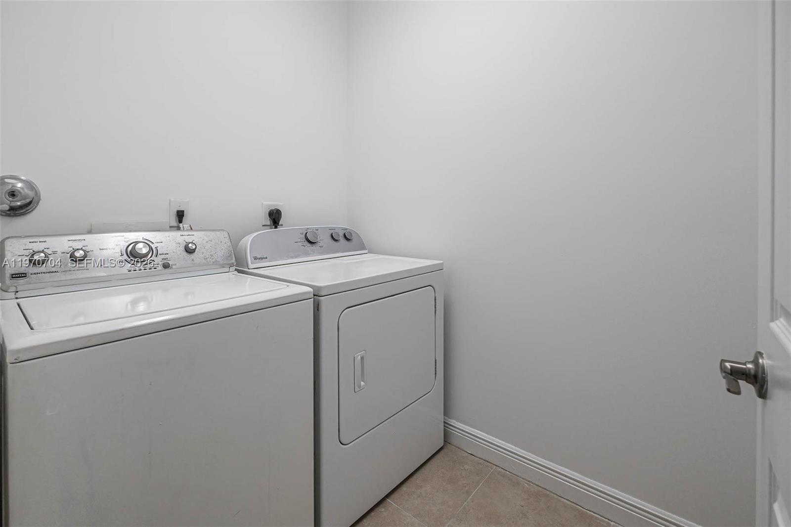 7651 North Pine Island Road Tamarac, FL 33321 - Photo 7 of 9 a utility room with dryer and washer