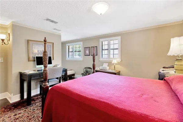a bedroom with a bed and a table in it
