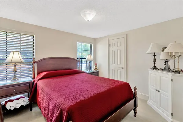 a bedroom with a bed and a cabinets