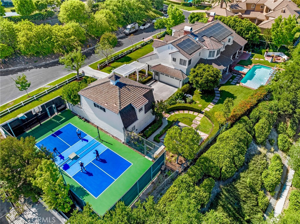 an aerial view of a house with a yard pool outdoor seating and yard