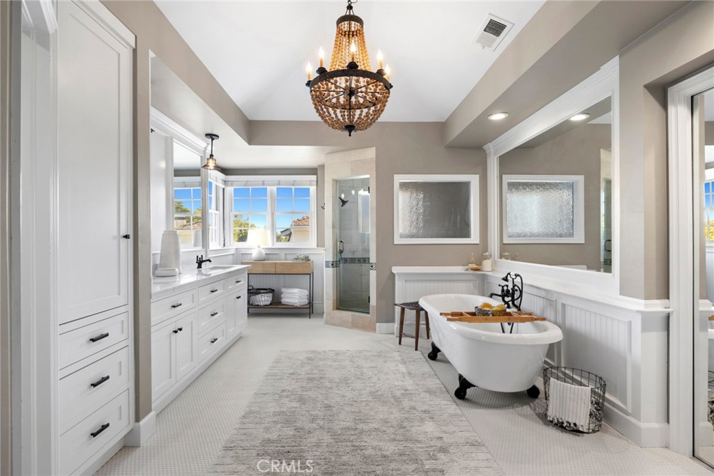 4 Percheron Coto de Caza, CA 92679 - Photo 17 of 44 a spacious bathroom with a tub sink and mirror