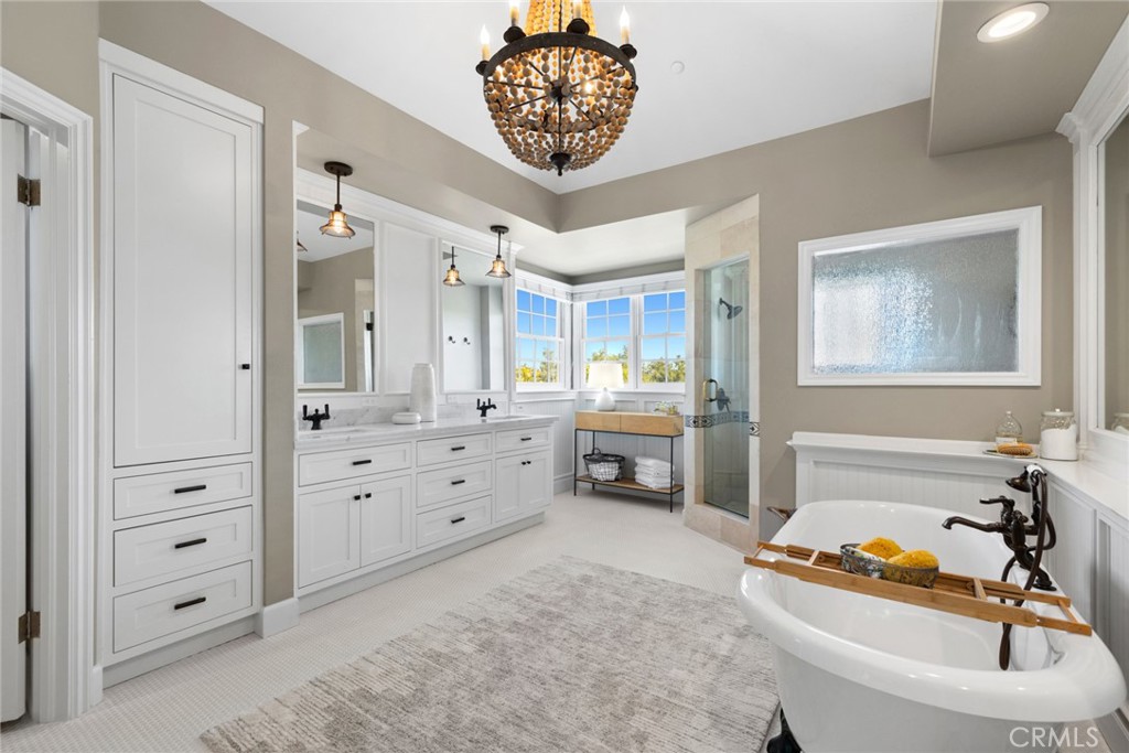 4 Percheron Coto de Caza, CA 92679 - Photo 18 of 44 a spacious bedroom with a bed and a dresser