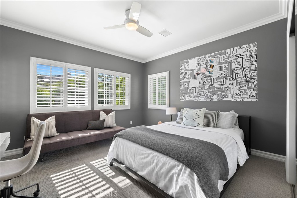 4 Percheron Coto de Caza, CA 92679 - Photo 20 of 44 a spacious bedroom with a bed a couch and a large window