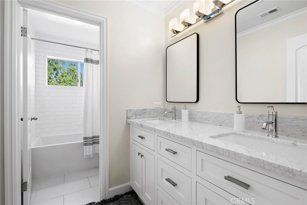 4 Percheron Coto de Caza, CA 92679 - Photo 22 of 44 a bathroom with double vanity sink two mirror and a shower