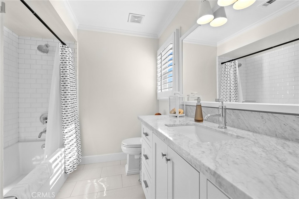 4 Percheron Coto de Caza, CA 92679 - Photo 24 of 44 a bathroom with a granite countertop sink a toilet and shower