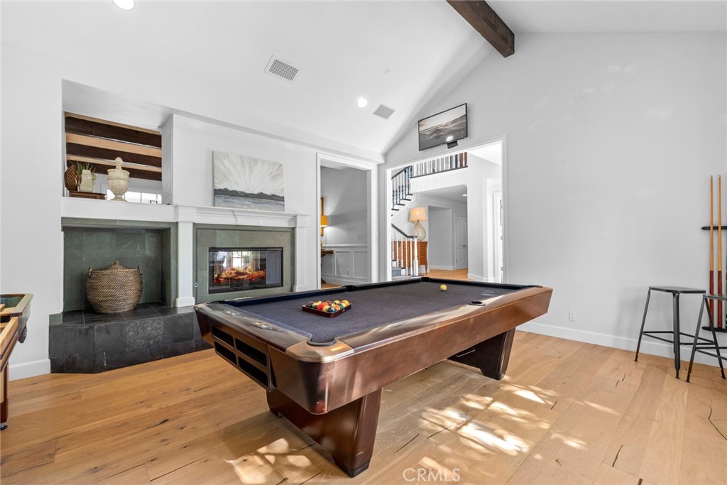 4 Percheron Coto de Caza, CA 92679 - Photo 6 of 44 a living room with furniture pool table and a fireplace