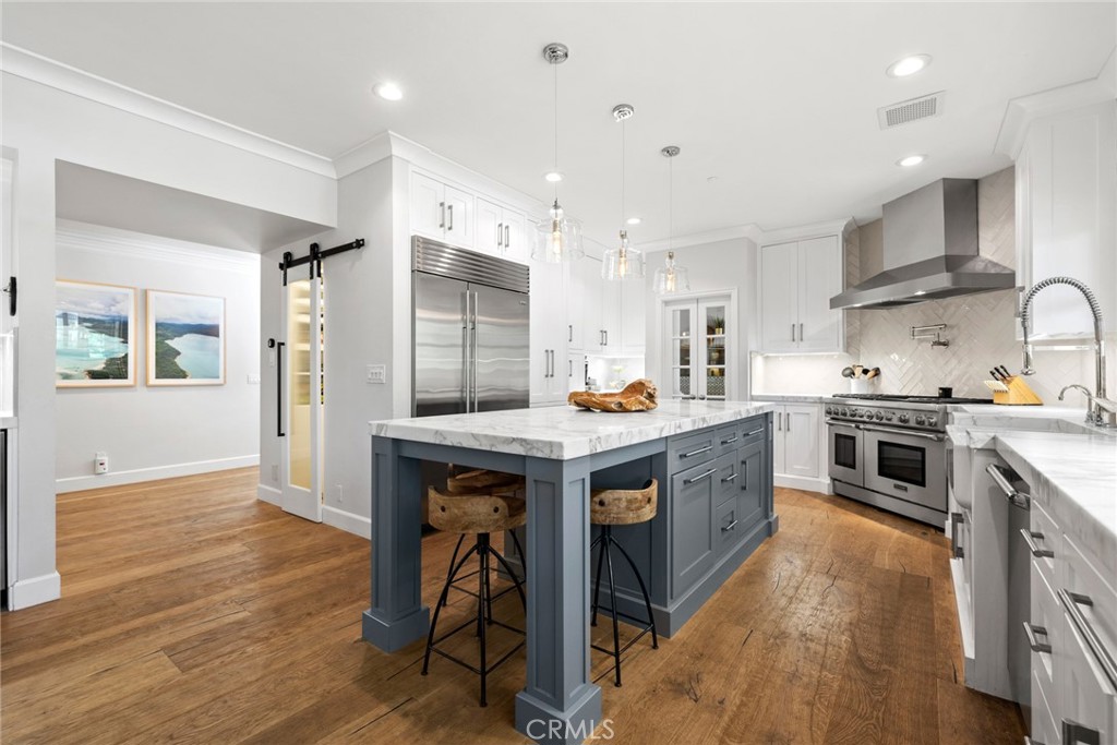 4 Percheron Coto de Caza, CA 92679 - Photo 8 of 44 a kitchen with a sink a counter top space stainless steel appliances and cabinets