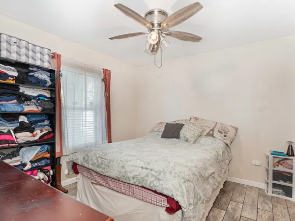 a bedroom with a bed and a closet