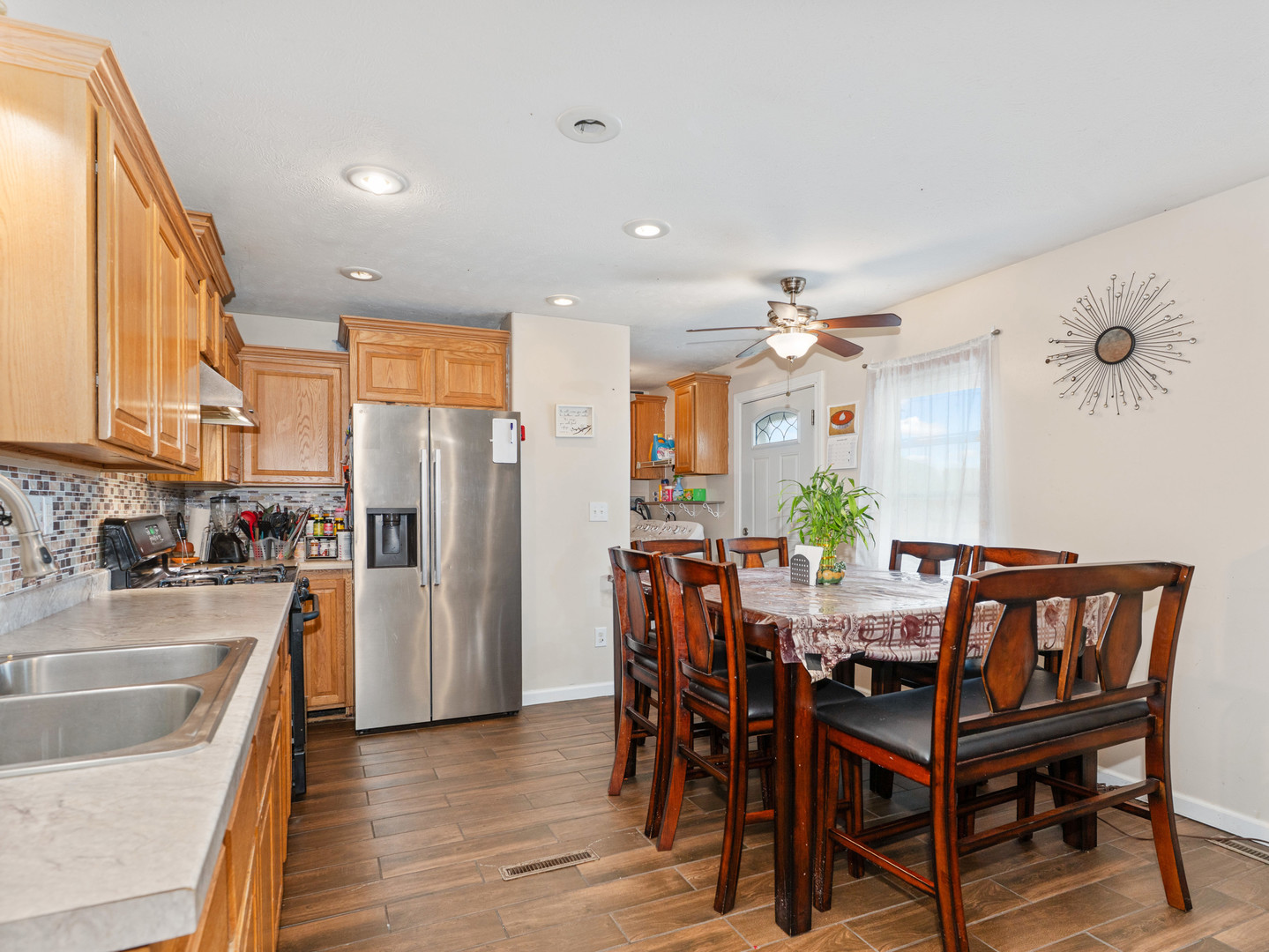 31 Peggy Drive Sandwich, IL 60548 - Photo 10 of 17 a view of a dining room with furniture window and wooden floor