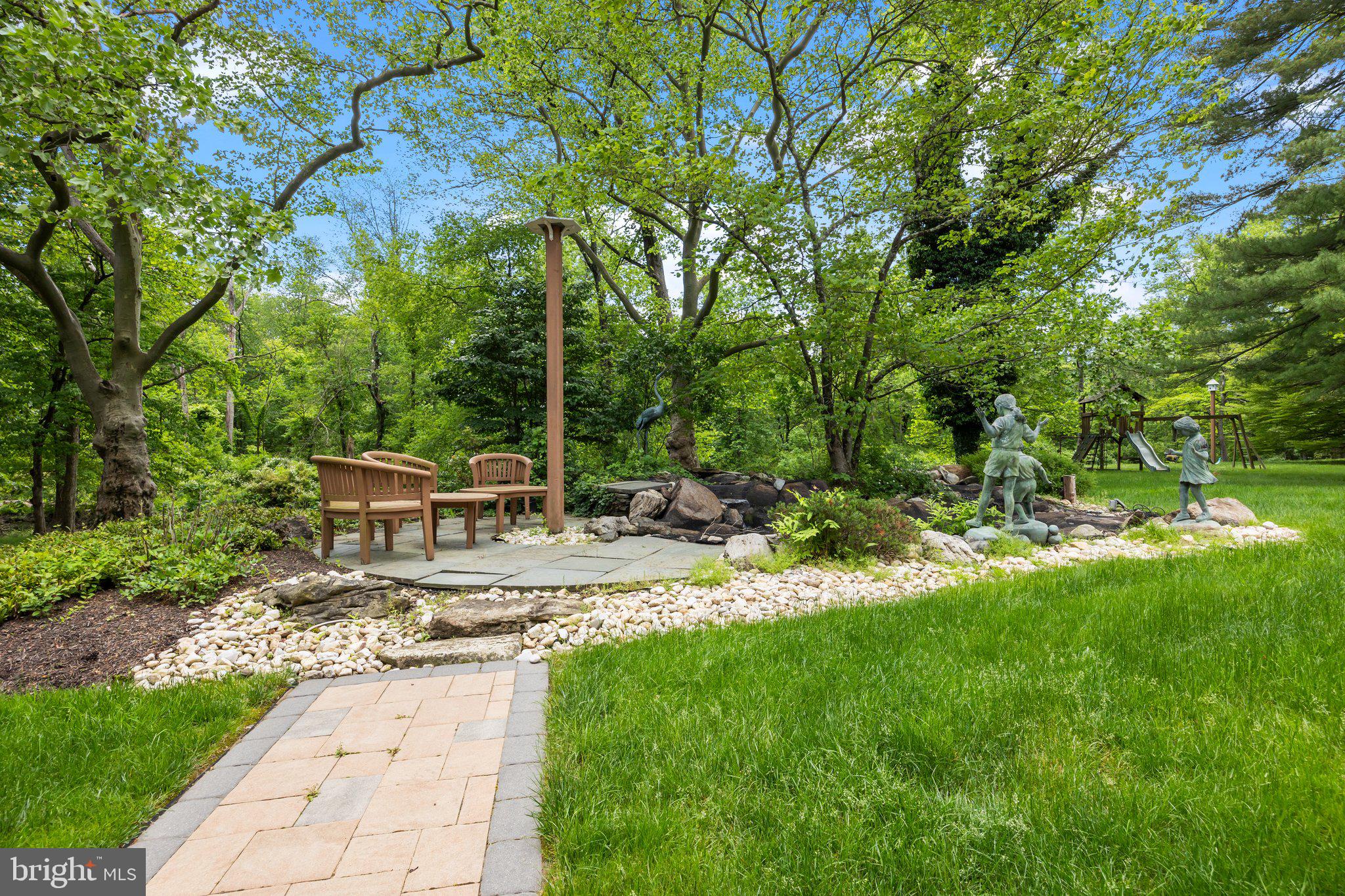 1049 McKean Road Ambler, PA 19002 - Photo 11 of 93 a view of a chair and tables in the garden