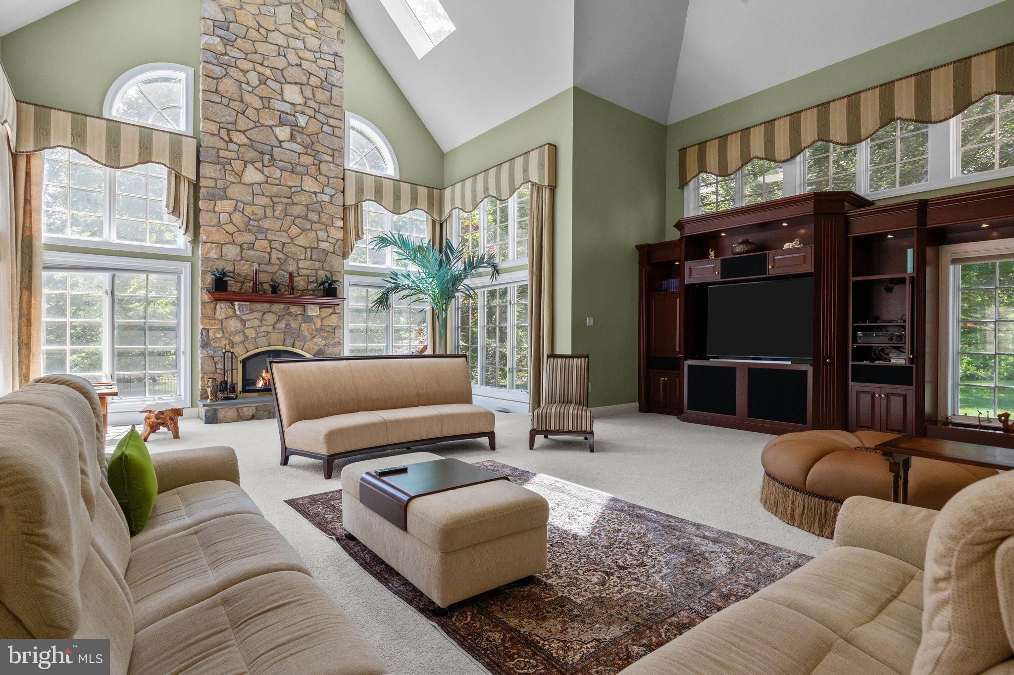 1049 McKean Road Ambler, PA 19002 - Photo 27 of 93 a living room with furniture ceiling fan and a fireplace