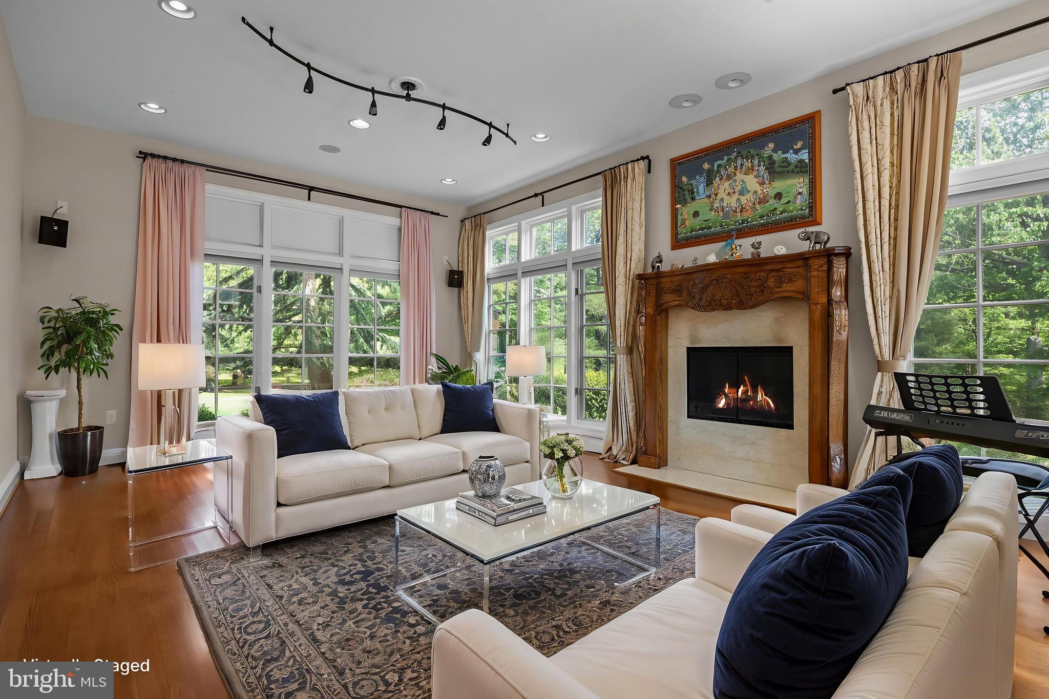 1049 McKean Road Ambler, PA 19002 - Photo 38 of 93 a living room with furniture large window and a fireplace