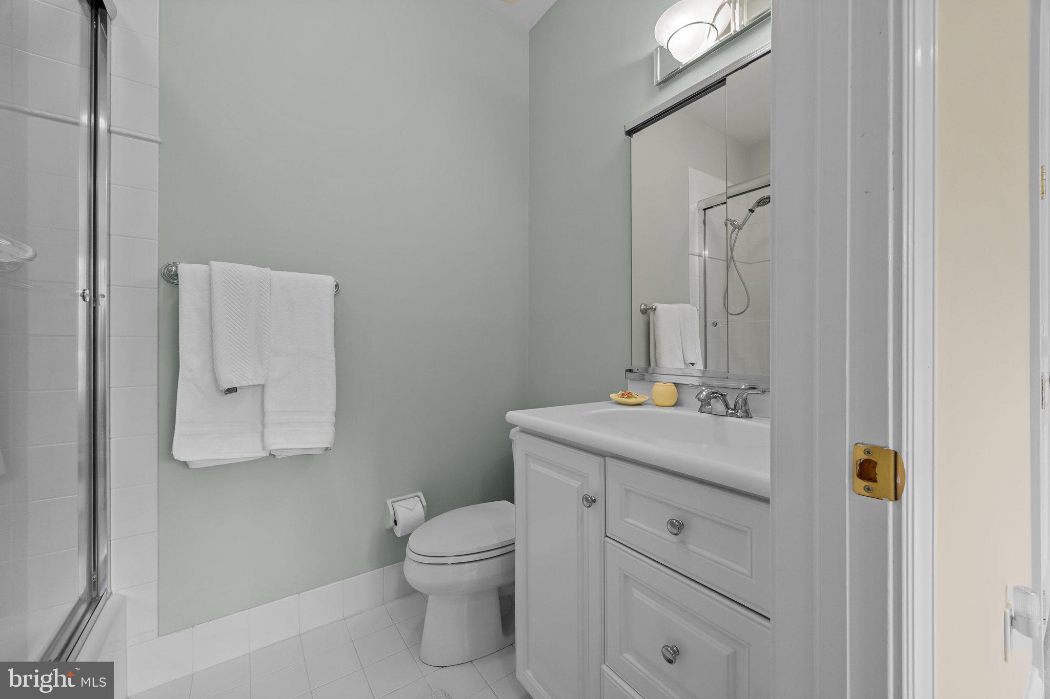 1049 McKean Road Ambler, PA 19002 - Photo 54 of 93 a bathroom with a toilet sink and mirror