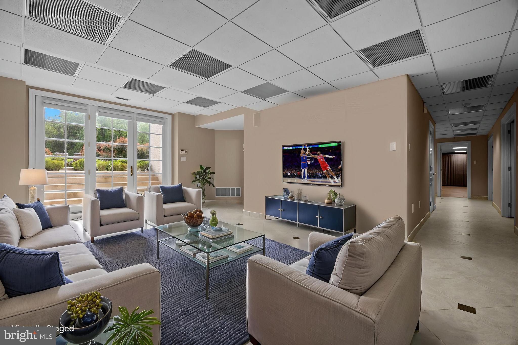 1049 McKean Road Ambler, PA 19002 - Photo 65 of 93 a living room with furniture and a flat screen tv