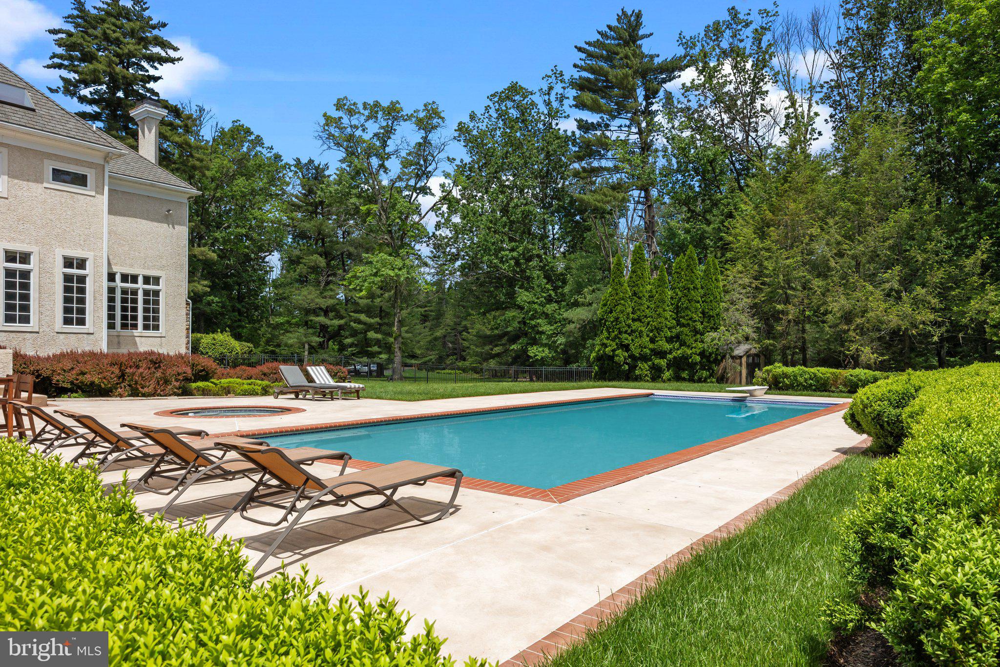 1049 McKean Road Ambler, PA 19002 - Photo 78 of 93 a view of a swimming pool with lounge chair