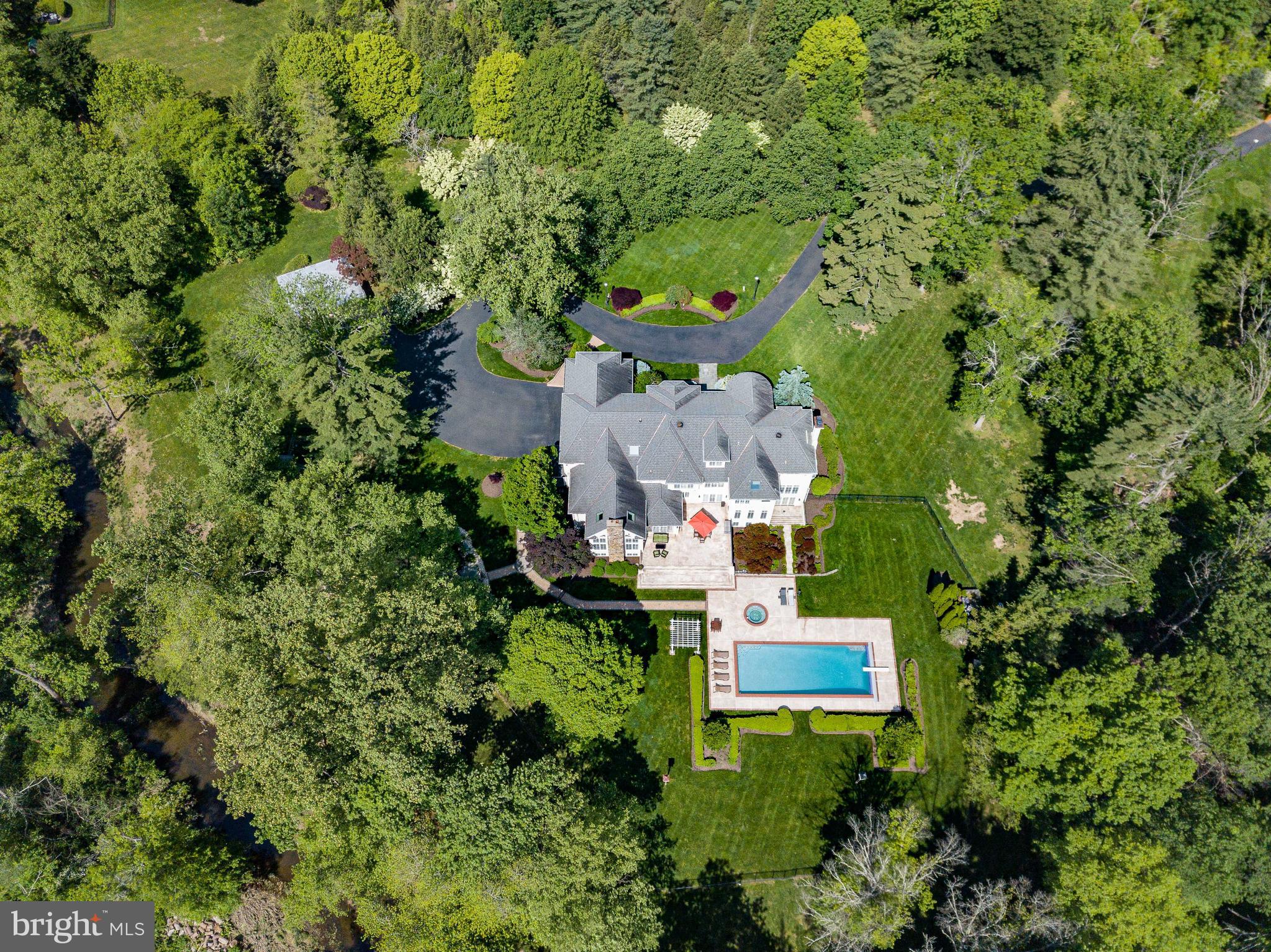 1049 McKean Road Ambler, PA 19002 - Photo 81 of 93 an aerial view of residential house with outdoor space and trees all around