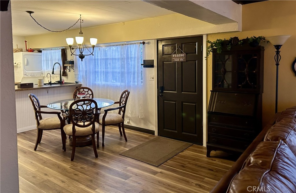28639 Rostrata Avenue Lake Elsinore, CA 92532 - Photo 13 of 43 a dining room with furniture and a closet