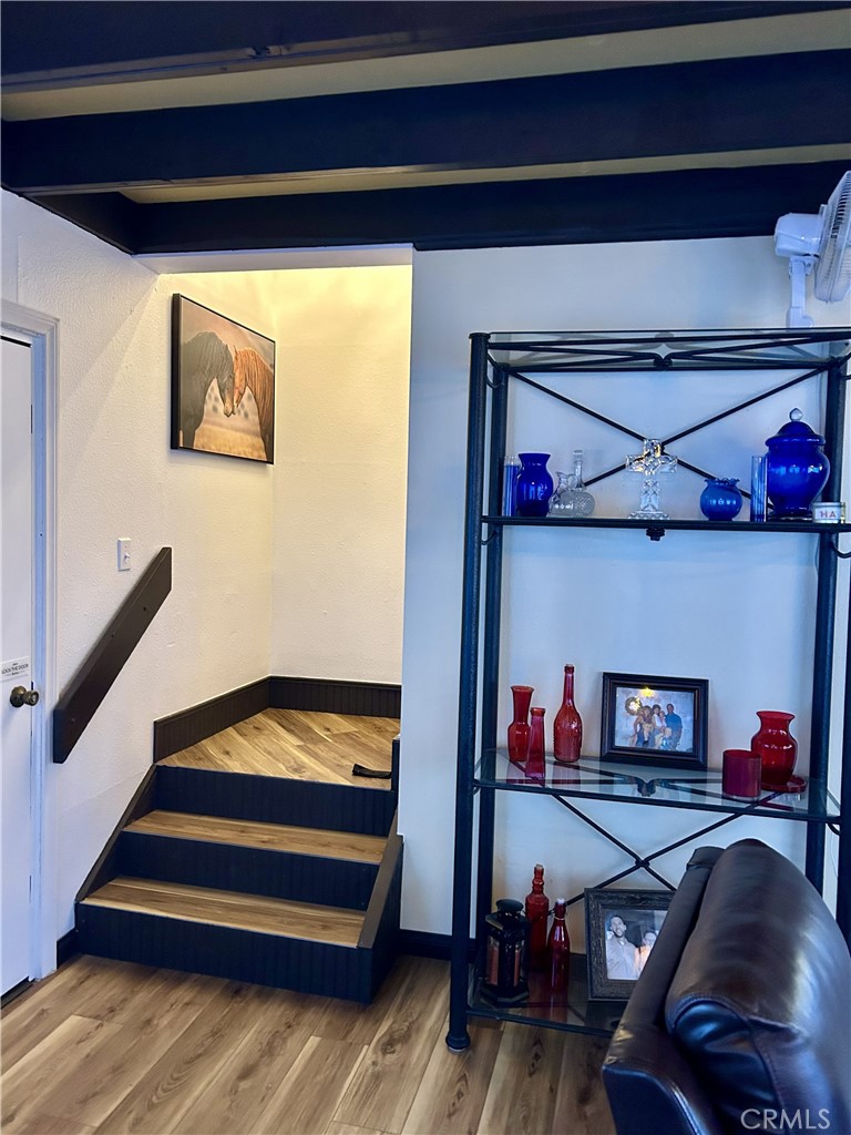 28639 Rostrata Avenue Lake Elsinore, CA 92532 - Photo 17 of 43 a view of staircase with wooden floor and stairs