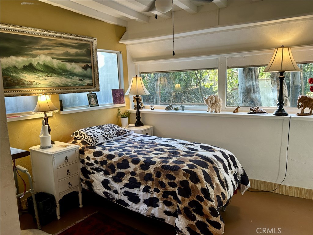 28639 Rostrata Avenue Lake Elsinore, CA 92532 - Photo 20 of 43 a bedroom with a bed and a window