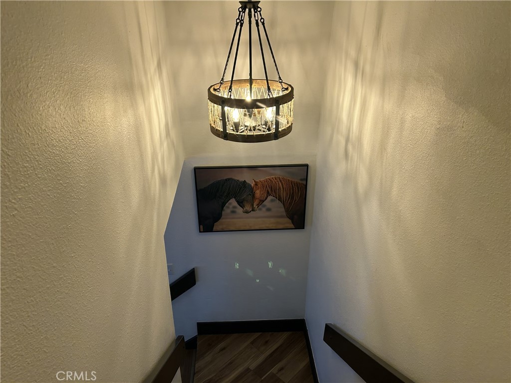 28639 Rostrata Avenue Lake Elsinore, CA 92532 - Photo 22 of 43 a room with a table and a mirror