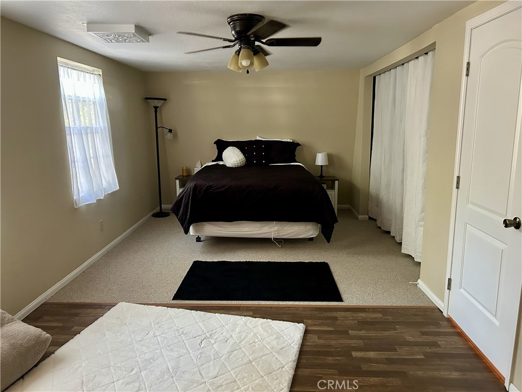 28639 Rostrata Avenue Lake Elsinore, CA 92532 - Photo 26 of 43 a bedroom with a bed and window