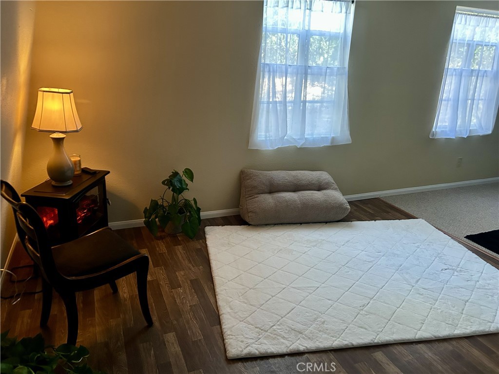 28639 Rostrata Avenue Lake Elsinore, CA 92532 - Photo 28 of 43 a room with furniture and a window