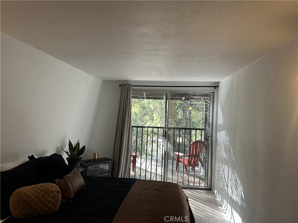 28639 Rostrata Avenue Lake Elsinore, CA 92532 - Photo 32 of 43 a living room with furniture and a potted plant