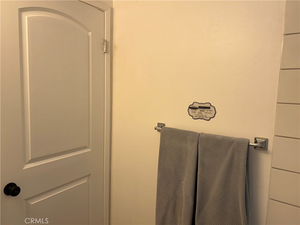 28639 Rostrata Avenue Lake Elsinore, CA 92532 - Photo 42 of 43 a bathroom with a glass door shower