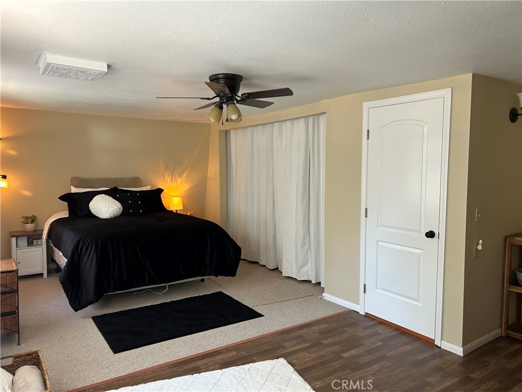 28639 Rostrata Avenue Lake Elsinore, CA 92532 - Photo 43 of 43 a bedroom with a bed and a closet