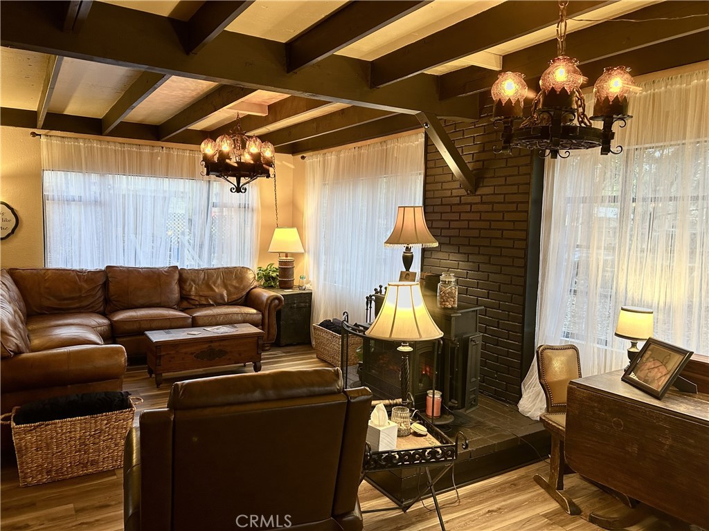 28639 Rostrata Avenue Lake Elsinore, CA 92532 - Photo 7 of 43 a living room with furniture and a window