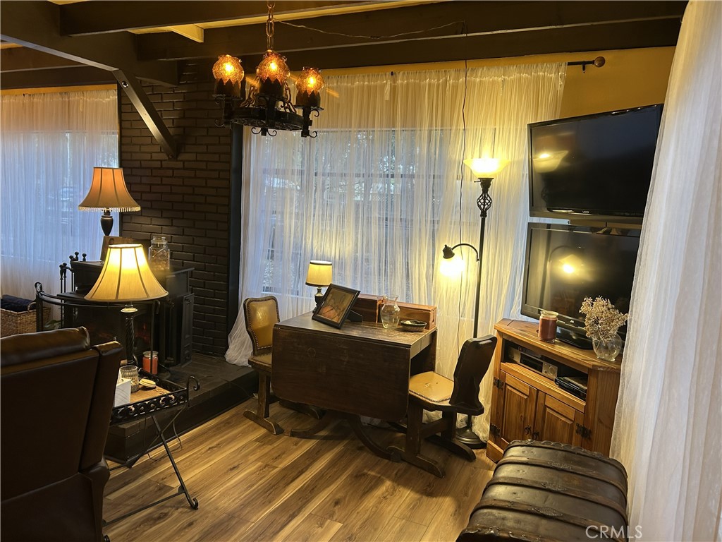 28639 Rostrata Avenue Lake Elsinore, CA 92532 - Photo 10 of 43 a view of a livingroom with furniture and a lamp