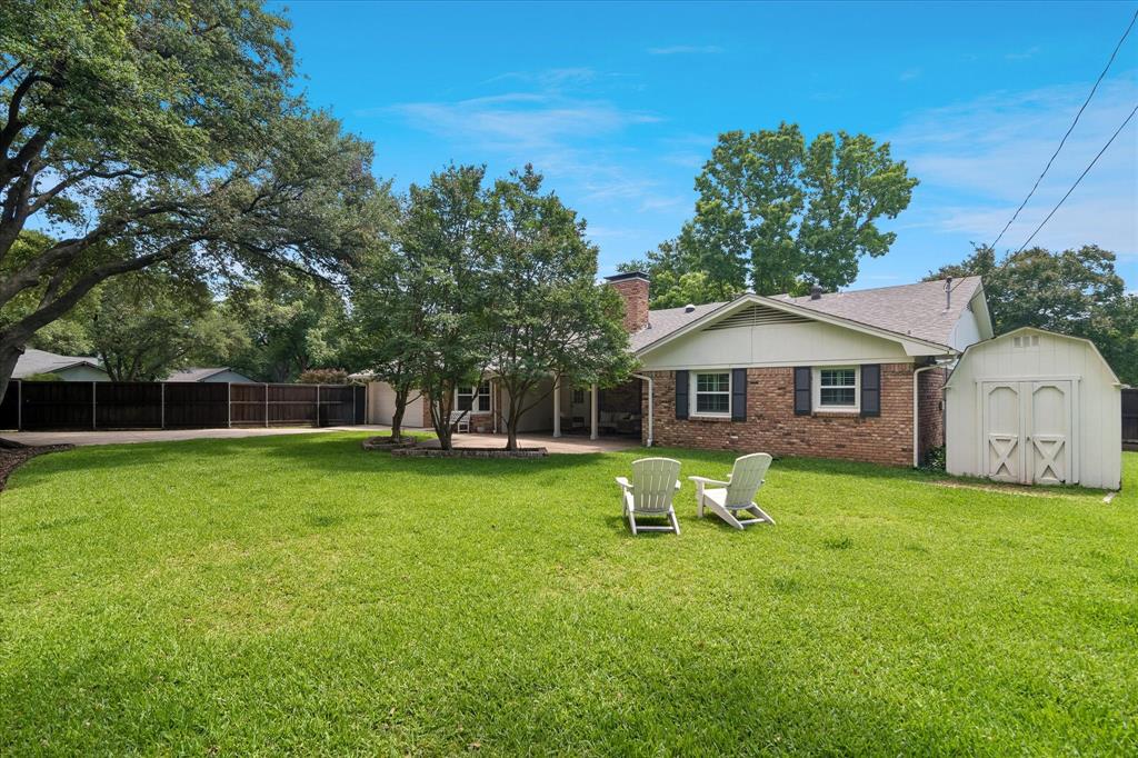 11439 Rosser Road Dallas, TX 75229 - Photo 30 of 35 a front view of a house with a yard