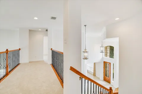 a view of a hallway with windows