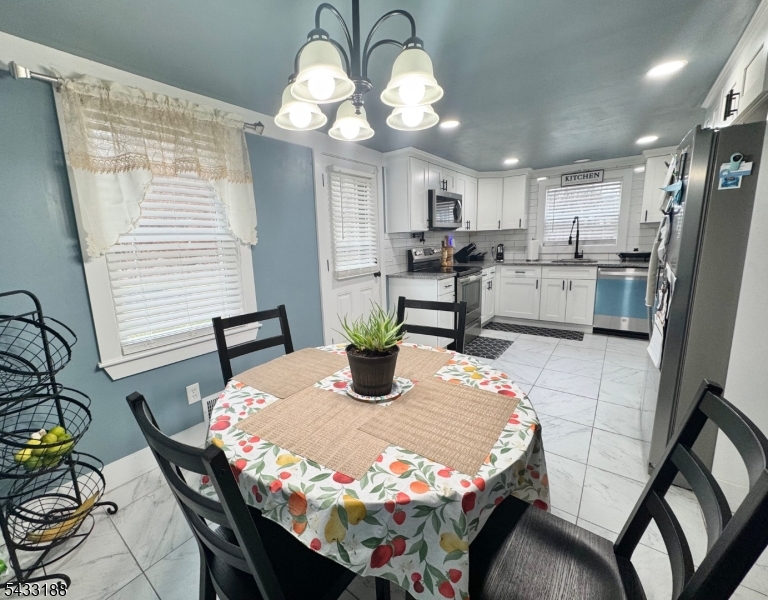 13 Highway 46 Columbia, NJ 07832 - Photo 9 of 22 a view of a dining room with furniture and a chandelier