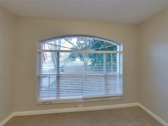 a view of empty room with a window