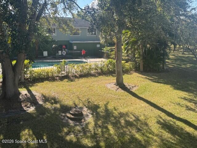 2232 Flower Tree Circle Melbourne, FL 32935 - Photo 12 of 13 a view of swimming pool with a patio