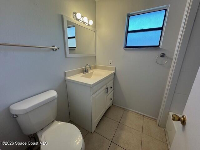 2232 Flower Tree Circle Melbourne, FL 32935 - Photo 13 of 17 a bathroom with a toilet sink and mirror